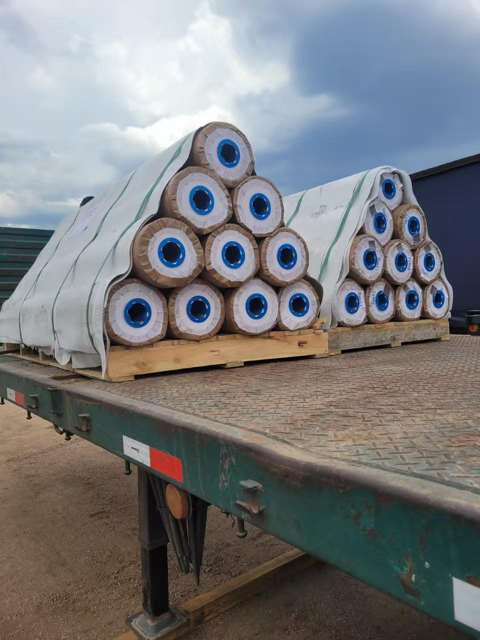 Flooring rolls secured on pallets