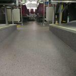 Anti-slip PVC flooring installed in a transit bus aisle