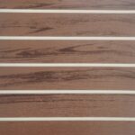 AU20-3652 printed PVC flooring texture for bus and coach interiors, a warm brown wood-grain plank pattern with pale dividing strips