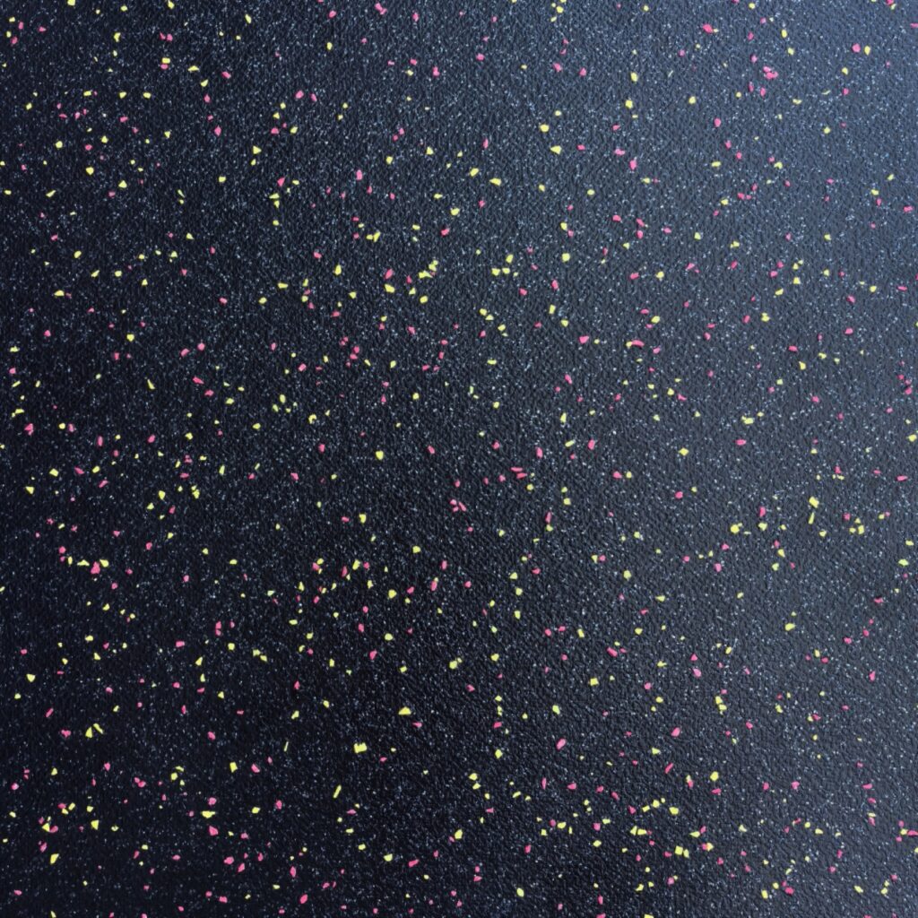 AU20-9601L lightweight PVC flooring texture for bus and coach interiors, a black textured base with pink and yellow flecks
