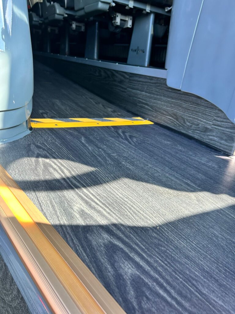 Black wood-grain transport flooring installed for a U.S. customer